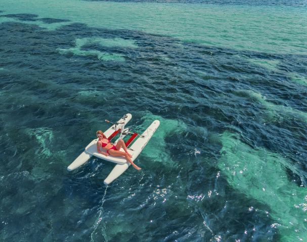 Relaxing on a Schiller waterbike on turquoise sea